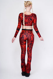 Red and black flared leggings with a hip cutout.