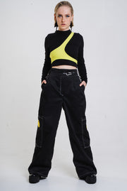 Black wide cut trousers with chain detail.