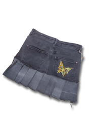 Upcycled jean mini skirt with pleats and a butterfly print,