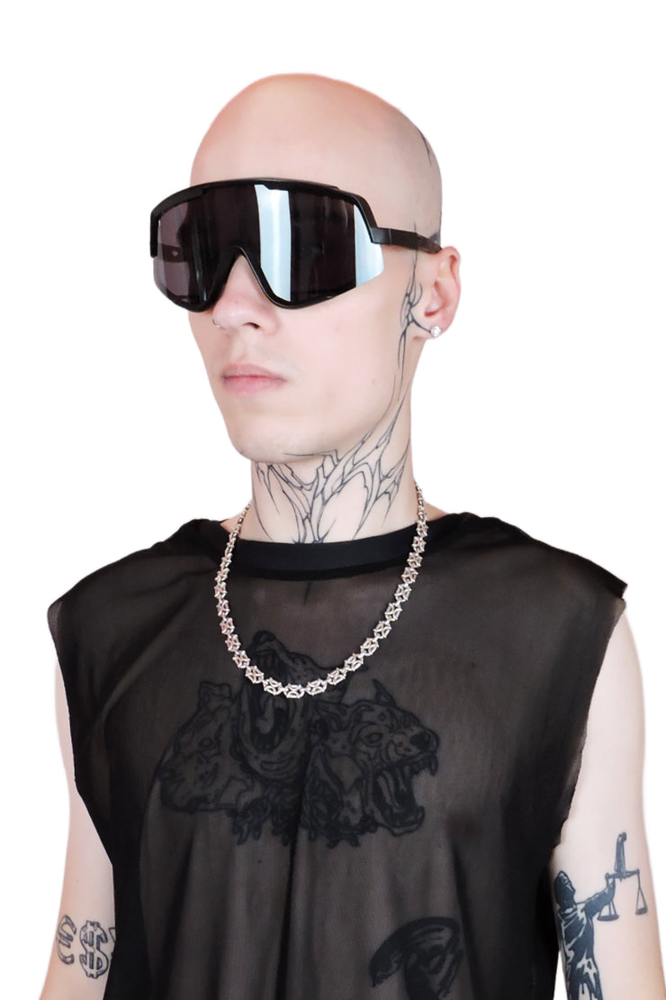 Oversized black futuristic sunglasses with bold angular frames and sleek black lenses. For men or women.
