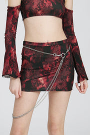 Red snake-print mini skirt in a tight, body-hugging fit, displayed on a white background.