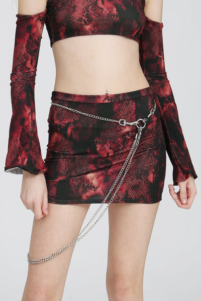 Red snake-print mini skirt in a tight, body-hugging fit, displayed on a white background.