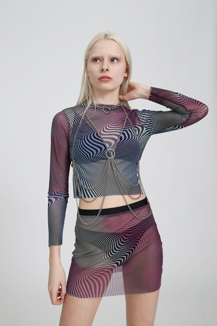 Mesh longsleeve top in a purple, blue, pink, and black abstract print on a white background, fitted and sheer with stretchy fabric.