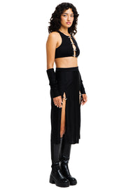 Mid length black skirt with high slits and silver carabiner closures.