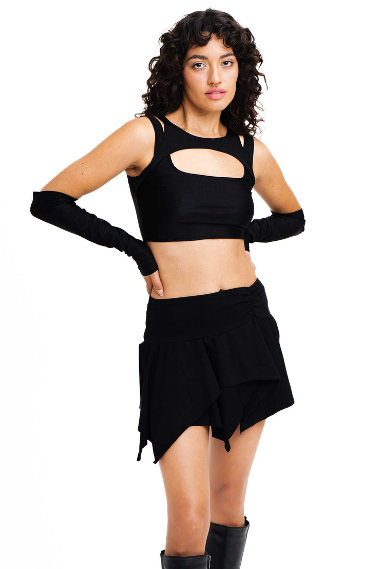 Black layered mini skirt in a fairy-core style.