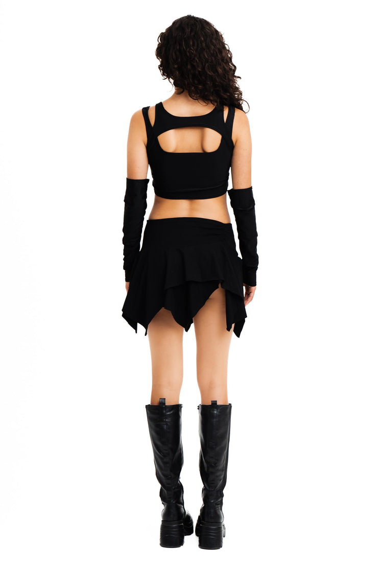 Layered black top with matching sleeves for raves.