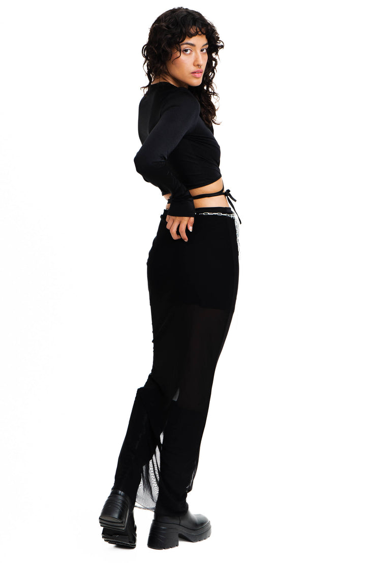 Long sleeve black top with a tie on closure and large cutout.