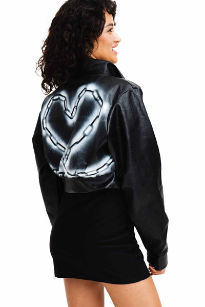 Black vegan jacket with white heart on the back.