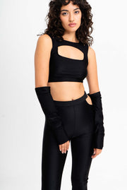 Black flared leggings with hip cutouts and chunky buckles.