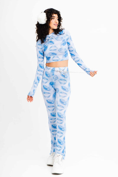 Blue and white flare leggings with a 2000s style print.