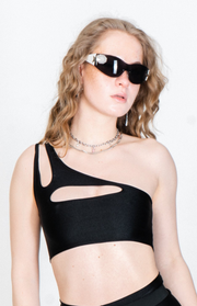Strappy black top with asymmetric cutouts for raves.