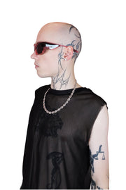 Transparent pink sunglasses with bold, reflective lenses and sleek, modern frame from the side. For men or women.