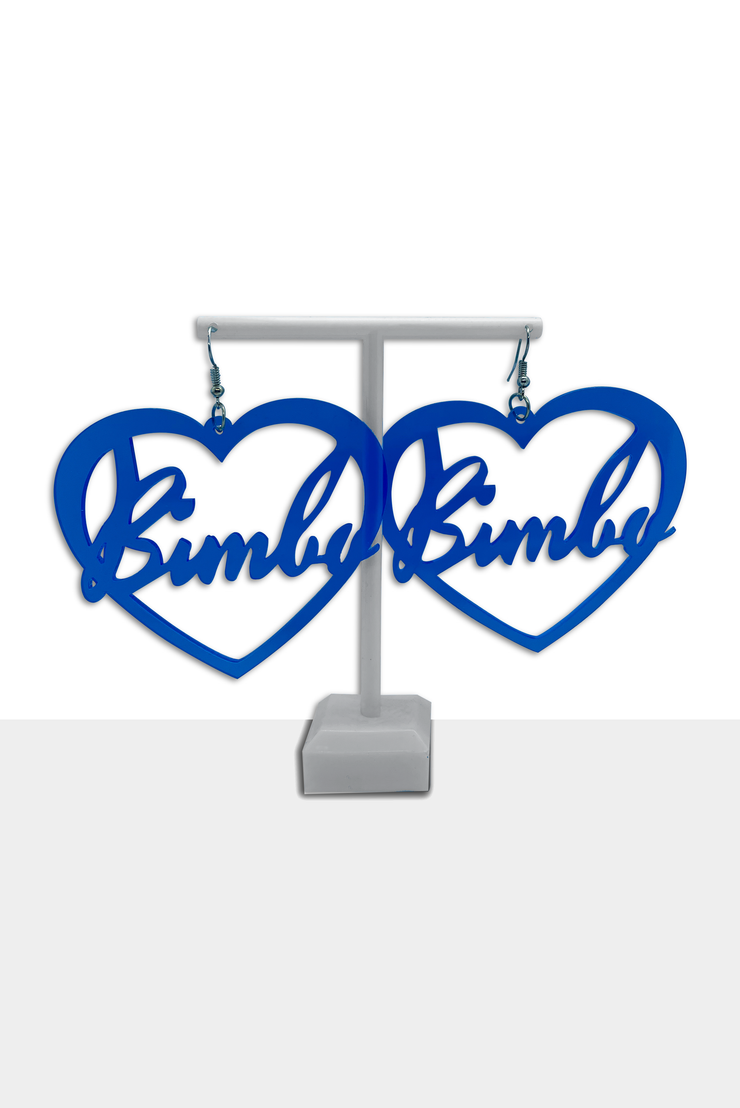Oversized clear blue earrings in a heart form with a "Bimbo" text.
