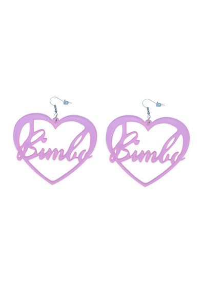 Oversized clear pink earrings in a heart form with a "Bimbo" text.
