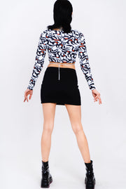 Black, white, and red tribal print layered top.