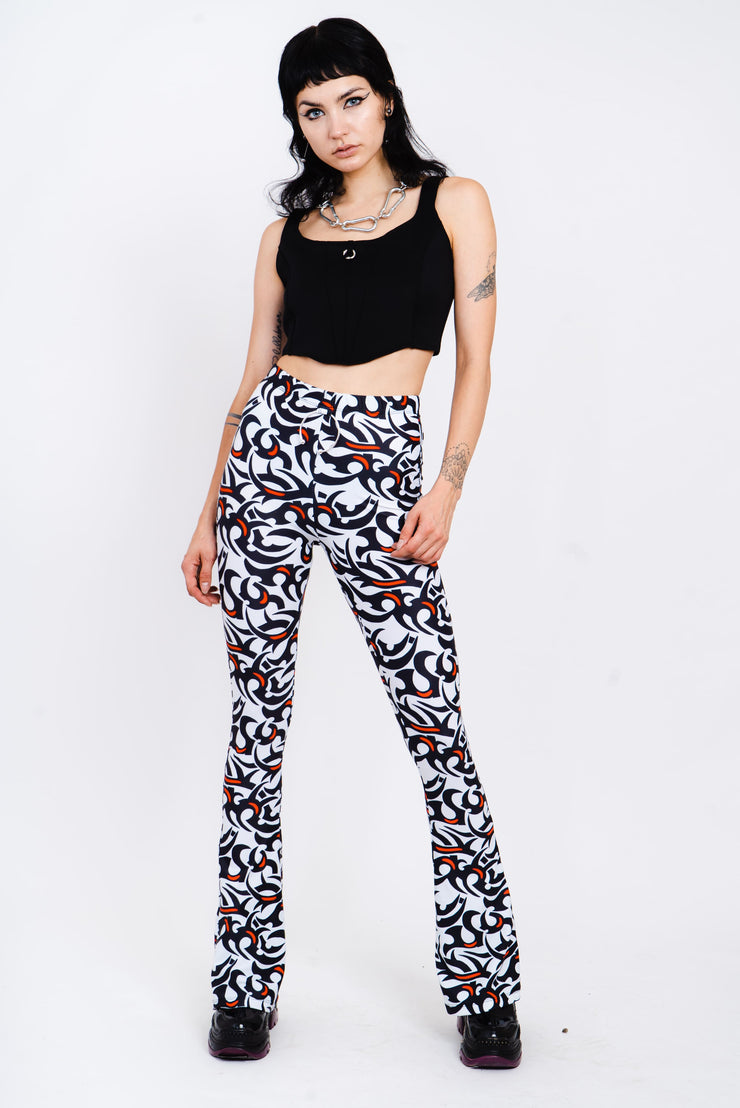 Black, white, and red tribal print flare leggings.