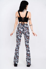 Black, white, and red tribal print flare leggings.