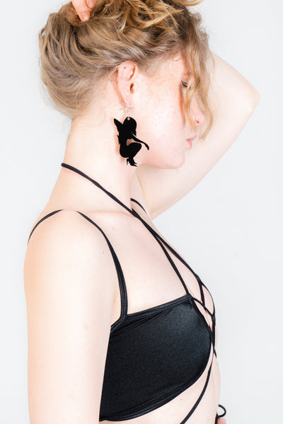 Black angel and devil statement earrings.