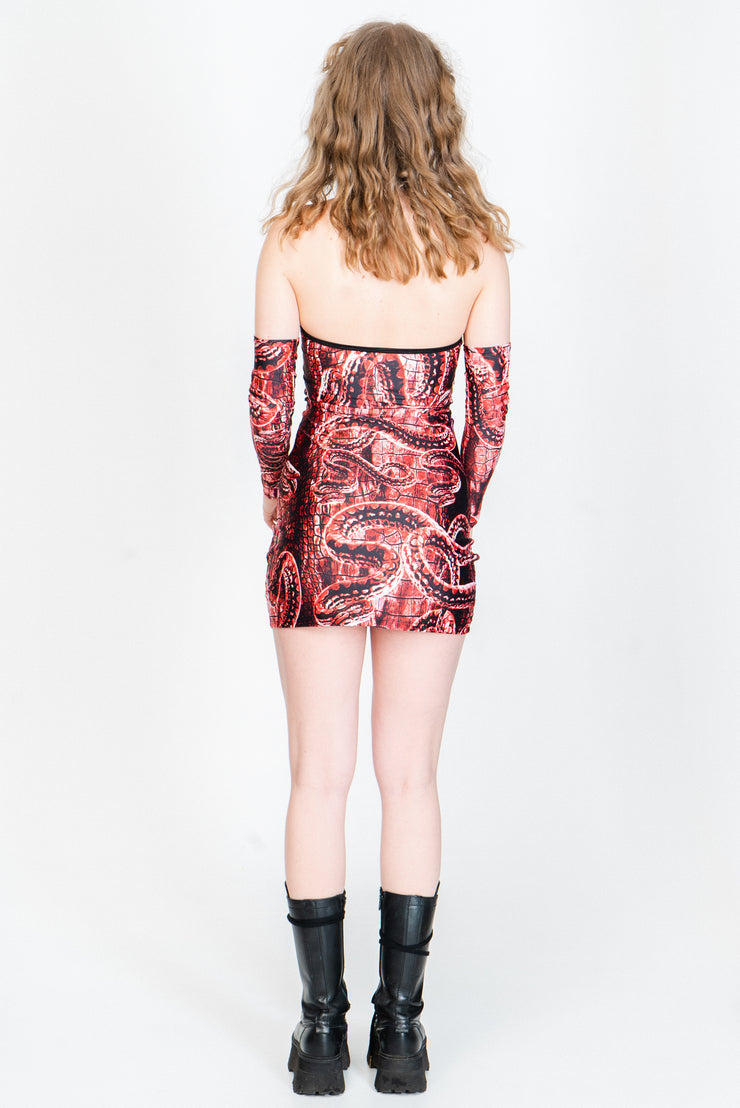 Red and black snake print mini dress with keyhole cutout.