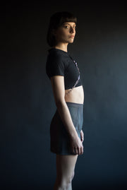 Cropped black cotton tshirt with o-ring and silver chains.