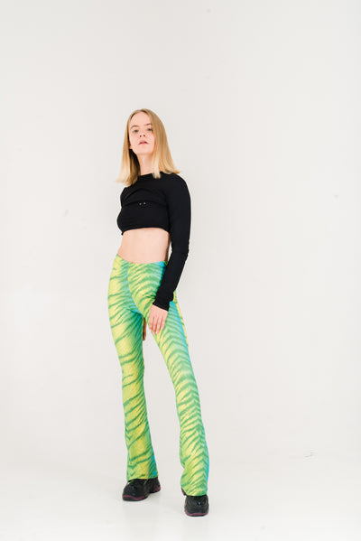 Neon green and blue tiger print flared leggings.