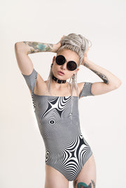 Trippy black and white bodysuit with short sleeves.