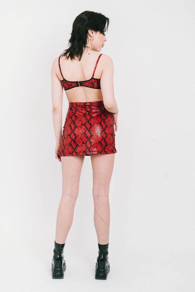 Shiny red snake print bra with no cups.