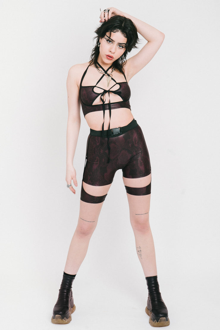 Layered strappy shorts in the "Lara Croft" style made out of purple snake print fabric