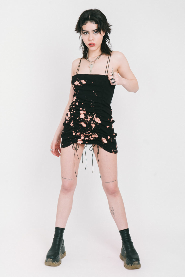 Bleached black mini dress with gathers in the front and back. 