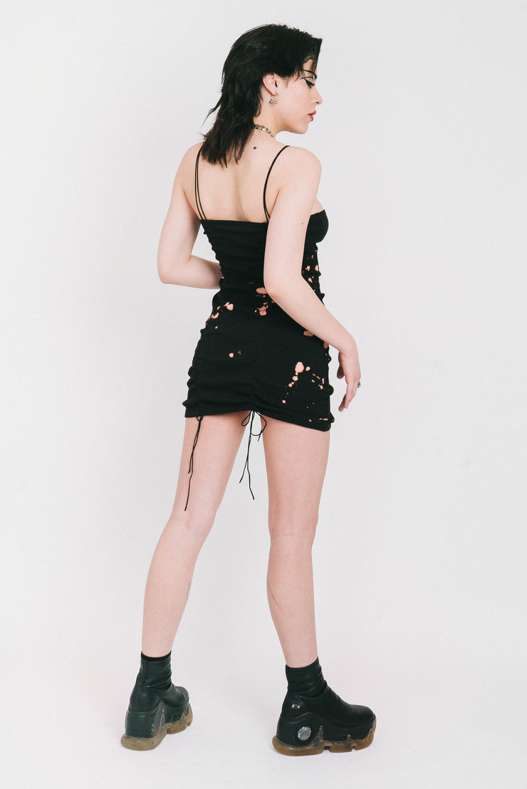 Bleached black mini dress with gathers in the front and back. 