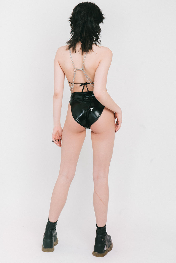 Black vinyl bikini bottoms with a piercing detail and matching bikini top.