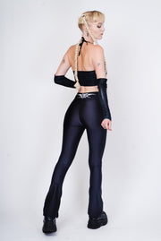 Black flared leggings with a tribal tattoo on the back in an alternative goth style.