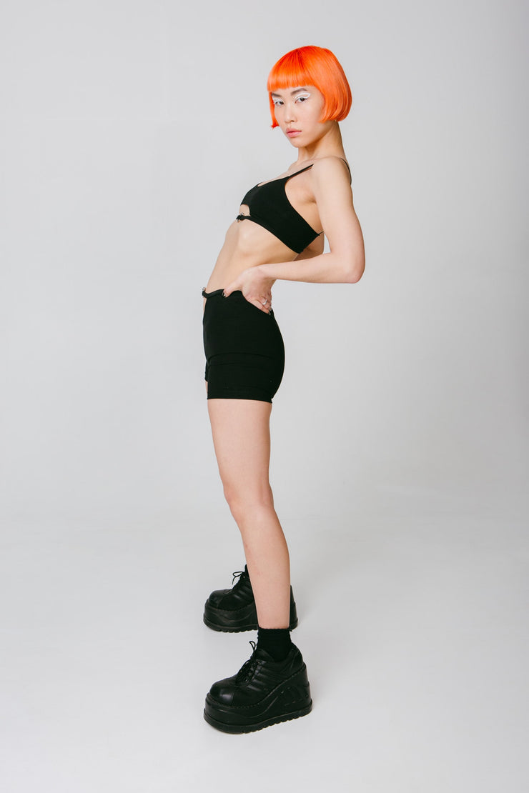 black ctop and booty shorts with hardware and cutouts
