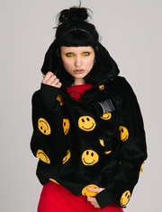 black jacket with yellow smiley faces and buckles