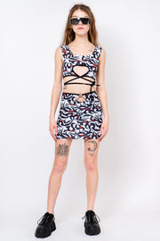 Tribal print skirt with keyhole cutout and chain belt.