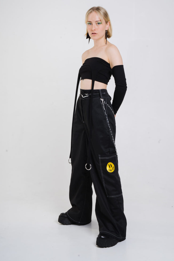 Black wide cut trousers with chain detail.